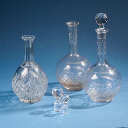 BACCARAT;
Set of three carafes in cut crystal...