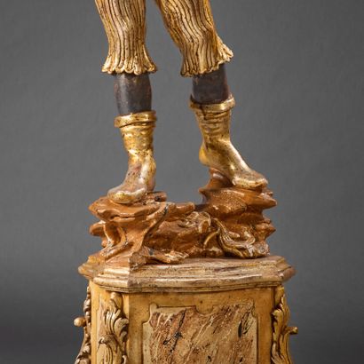 Wooden torch holder carved with a Nubian...
