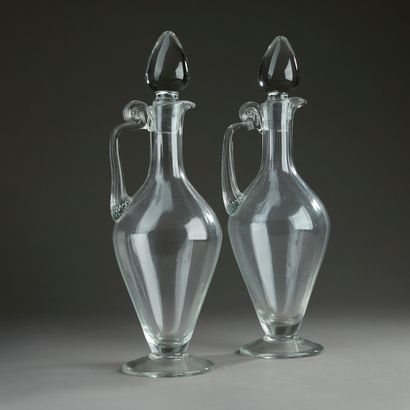 Pair of baluster ewers in blown glass, the...