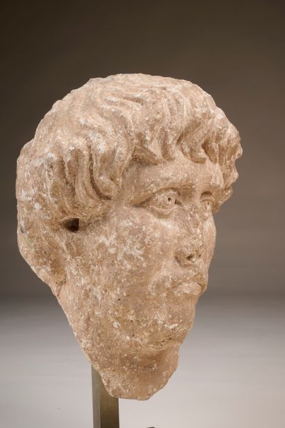 High-relief sculpted head of a moustachioed,...