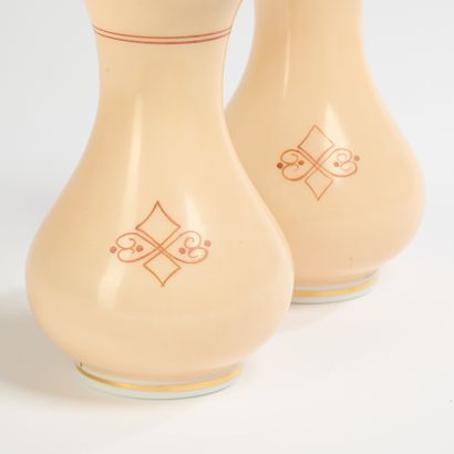 Pair of beige opaline glass vases, one decorated...