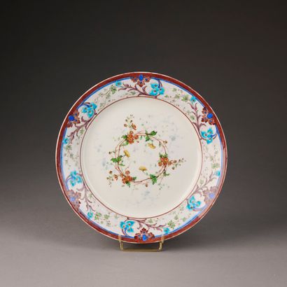 Porcelain plate enameled with foliage, scrolls...