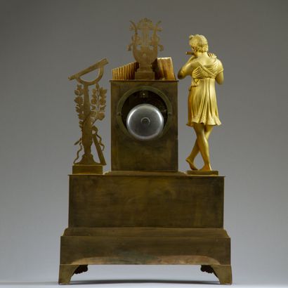 Chased and gilt bronze clock. The silvered...