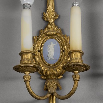 Pair of two-light ormolu sconces. 
The knotted...