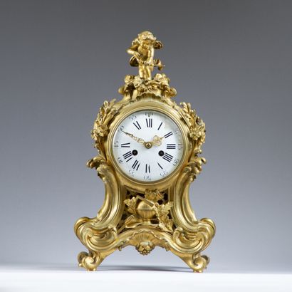 Fiddle-shaped clock in molded, chased and...