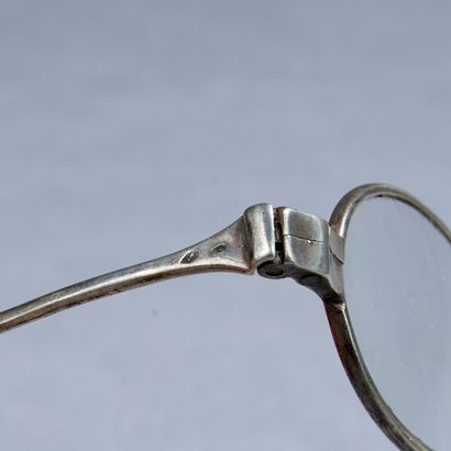 Three pairs of glasses or binoculars, mounted...