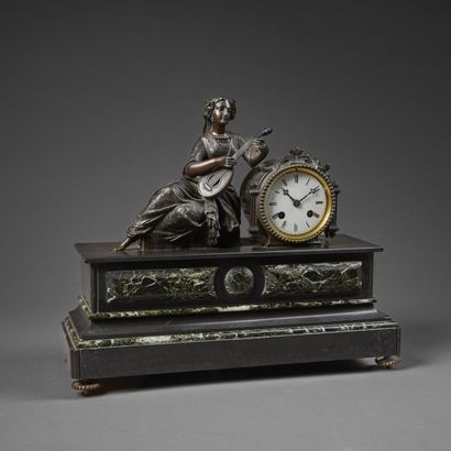 Chased bronze clock with brown patina and...