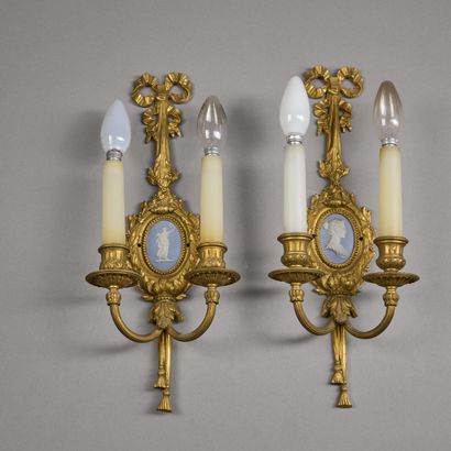 Pair of two-light ormolu sconces. 
The knotted...