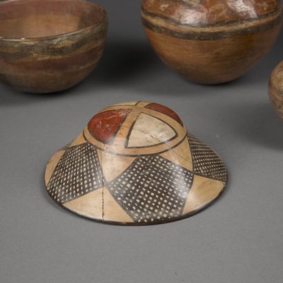 Set of four terracotta pieces painted with...