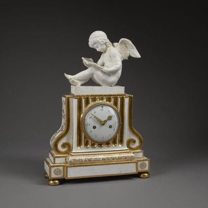 Boundary clock in white enameled and gilded...