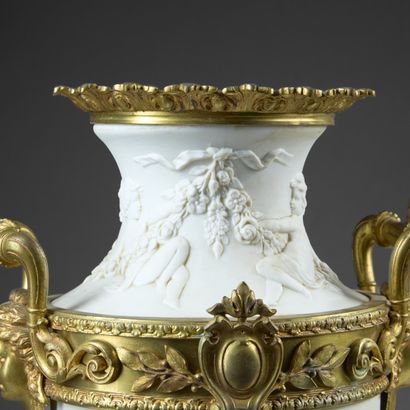 Pair of molded white composition vases decorated...