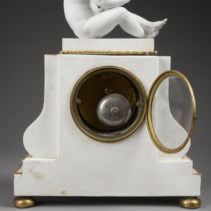 Boundary clock in white enameled and gilded...