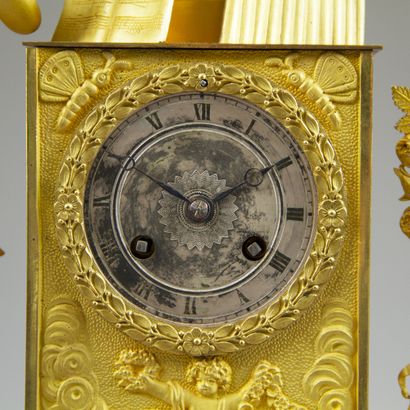 Chased and gilt bronze clock. The silvered...