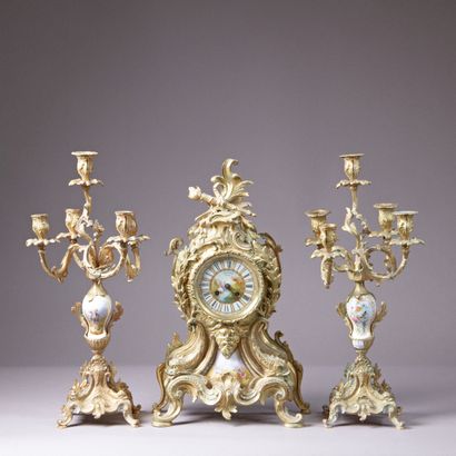 Chased and gilded bronze mantel set composed...