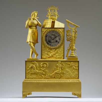 Chased and gilt bronze clock. The silvered...
