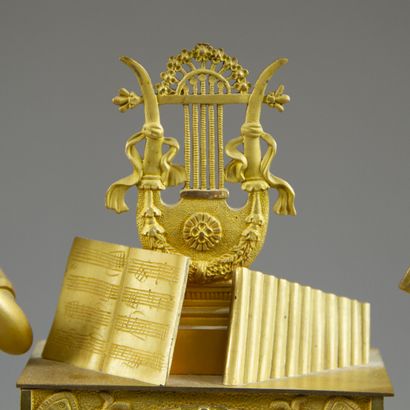 Chased and gilt bronze clock. The silvered...