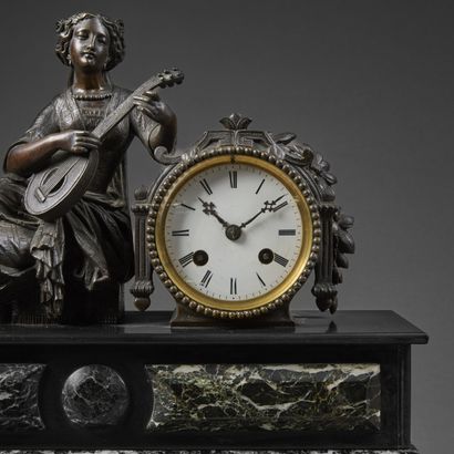Chased bronze clock with brown patina and...