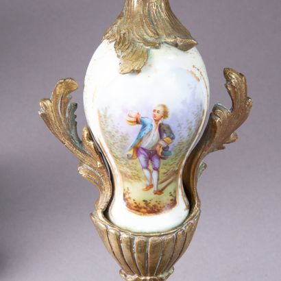 Chased and gilded bronze mantel set composed...