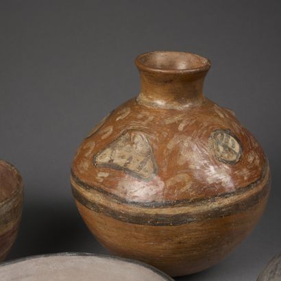 Set of four terracotta pieces painted with...