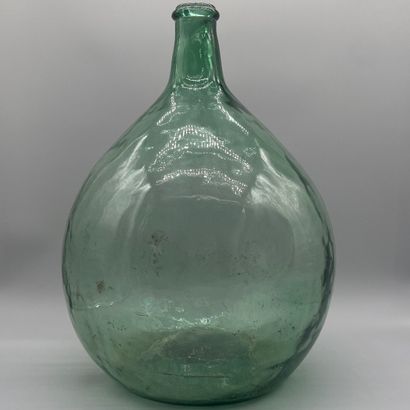 Dame-Jeanne in blown, green-tinted glass...