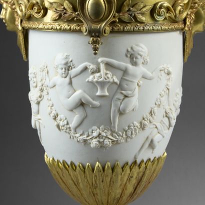 Pair of molded white composition vases decorated...