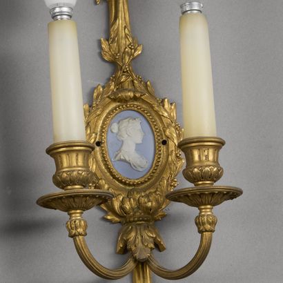 Pair of two-light ormolu sconces. 
The knotted...