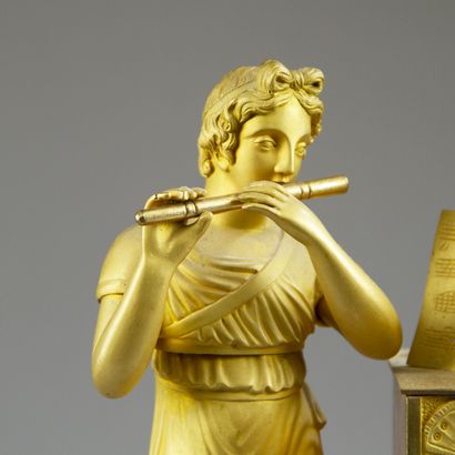 Chased and gilt bronze clock. The silvered...