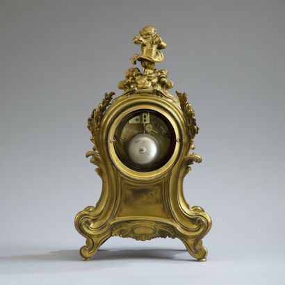 Fiddle-shaped clock in molded, chased and...