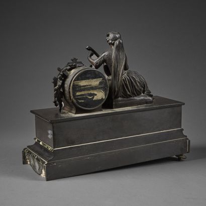 Chased bronze clock with brown patina and...