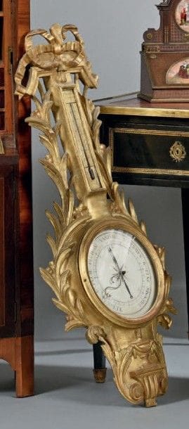 Grand baromètre thermomètre en bois sculpté...