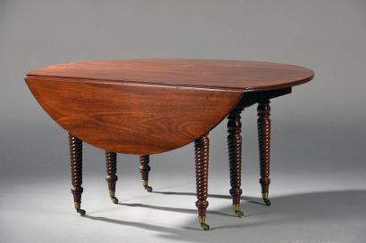Table de salle à manger à volets en acajou...