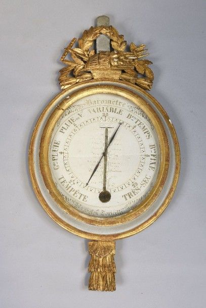 Baromètre-thermomètre en bois mouluré, sculpté,...