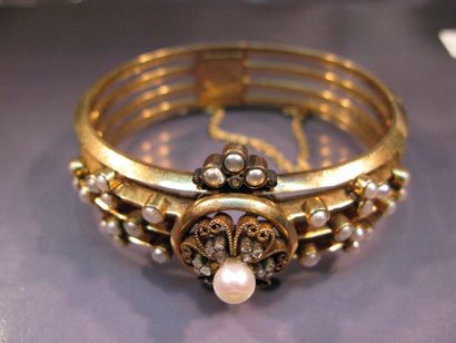 Bracelet rigide en or et argent à quatre...