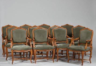 Suite de douze larges fauteuils à dossier...