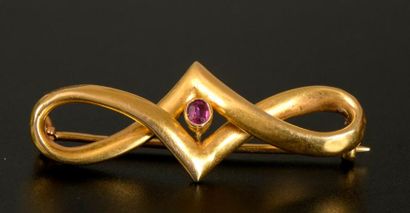 Broche nœud en or jaune 18K sertie clos d'un...
