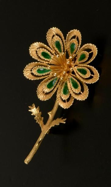Broche fleur en or jaune 18K à pistils rayonnants...