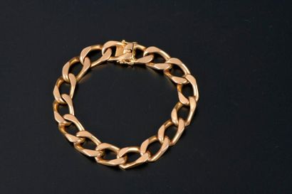 Bracelet gourmette en or jaune 18K. 

Long....