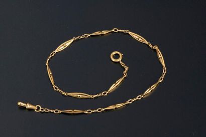 Sautoir en or jaune 18K à maillons polylobés...
