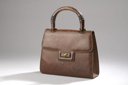 GUCCI
Sac à main en cuir cognac, l'anse en...