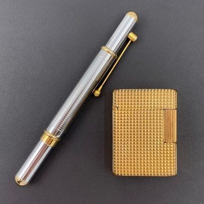 S.T. DUPONT 
LIGHTER in gold metal guilloché...