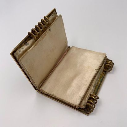 Two BAL BOOKS in chiselled amati gold metal...