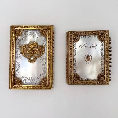 Two BAL BOOKS in chiselled amati gold metal...