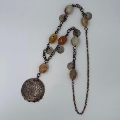 Important metal NECKLACE decorated with seven...