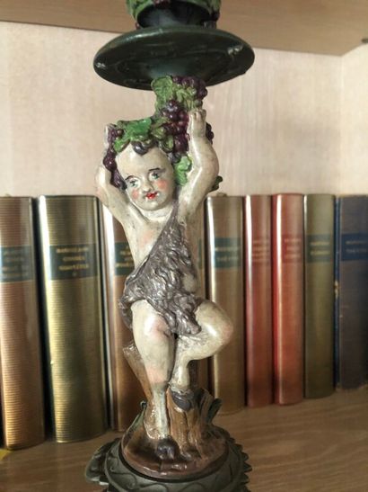Paire de bougeoirs à décor de putti drapés...
