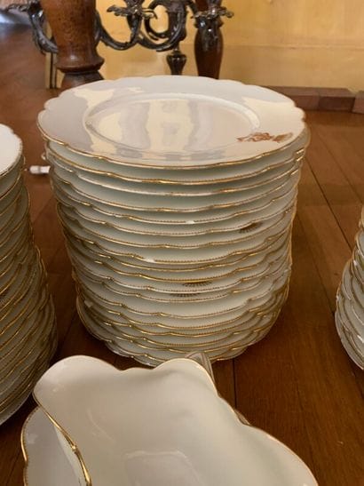 Part of service in white porcelain, gold...