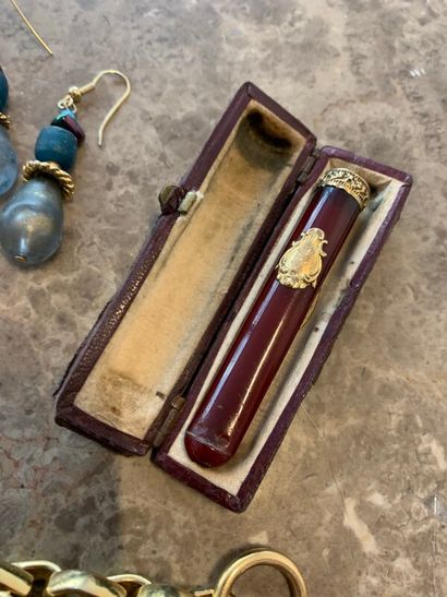 Lot of costume jewelry including cigarette...
