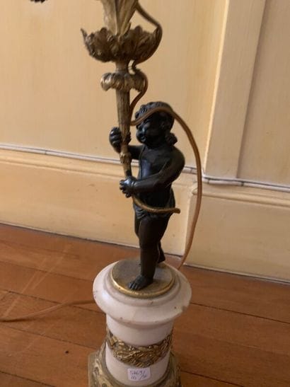 Pair of candelabras in chased and gilded...