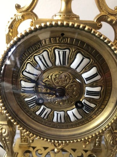 Mantelpiece clock in bronze, the enamelled...
