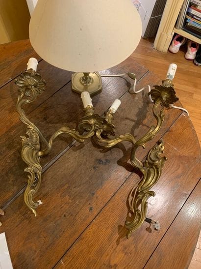 A pair of wall lamps of rocaille style in...