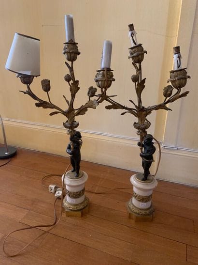 Pair of candelabras in chased and gilded...